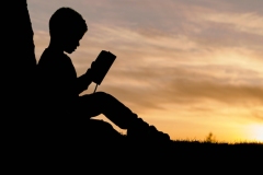 boy-reading-silhouette-aaron-burden-unsplash